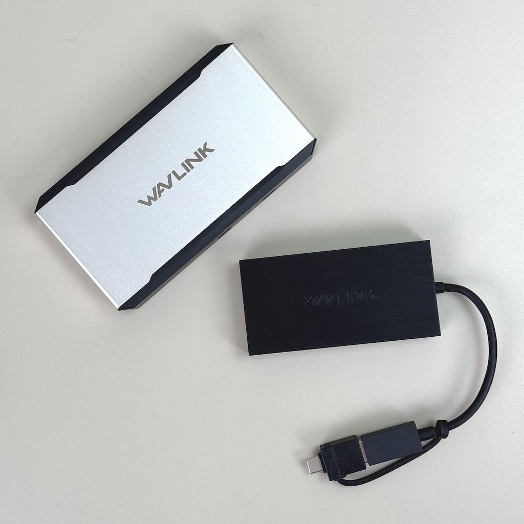 WL-UG6902H（下）和 WL-UG7701（上）是針對不同使用情景的產品，前者主打輕巧便攜，後者以一線連接多屏兼供電為賣點。